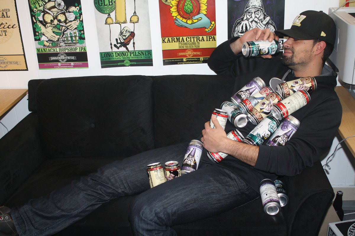 GreatLakesBeer's tweet photo. Sean heard that today is #BeerCanAppreciationDay, so he took a break to celebrate.

Sean might end up sleeping on the brewery couch tonight. https://t.co/m3fhaKwYdi