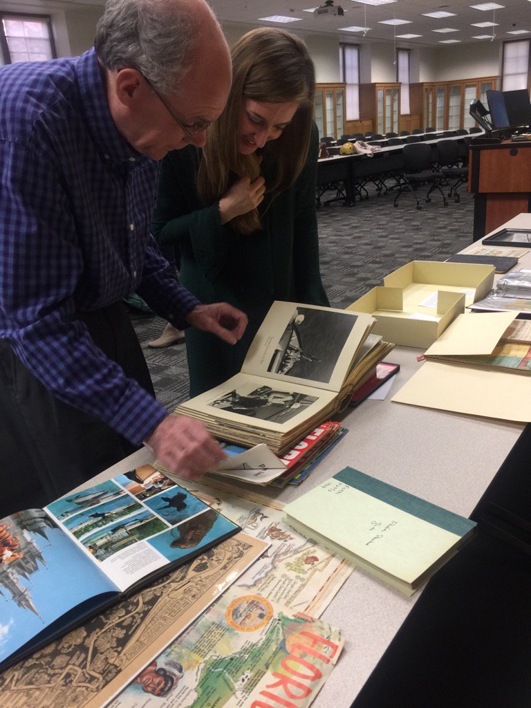 UFMuseumStudies's tweet photo. Lynea Wilson looks at collections with FL History Curator Jim Cusick prepping for exhibit on FL tourism #UFSASC https://t.co/fy8uNN2PVO