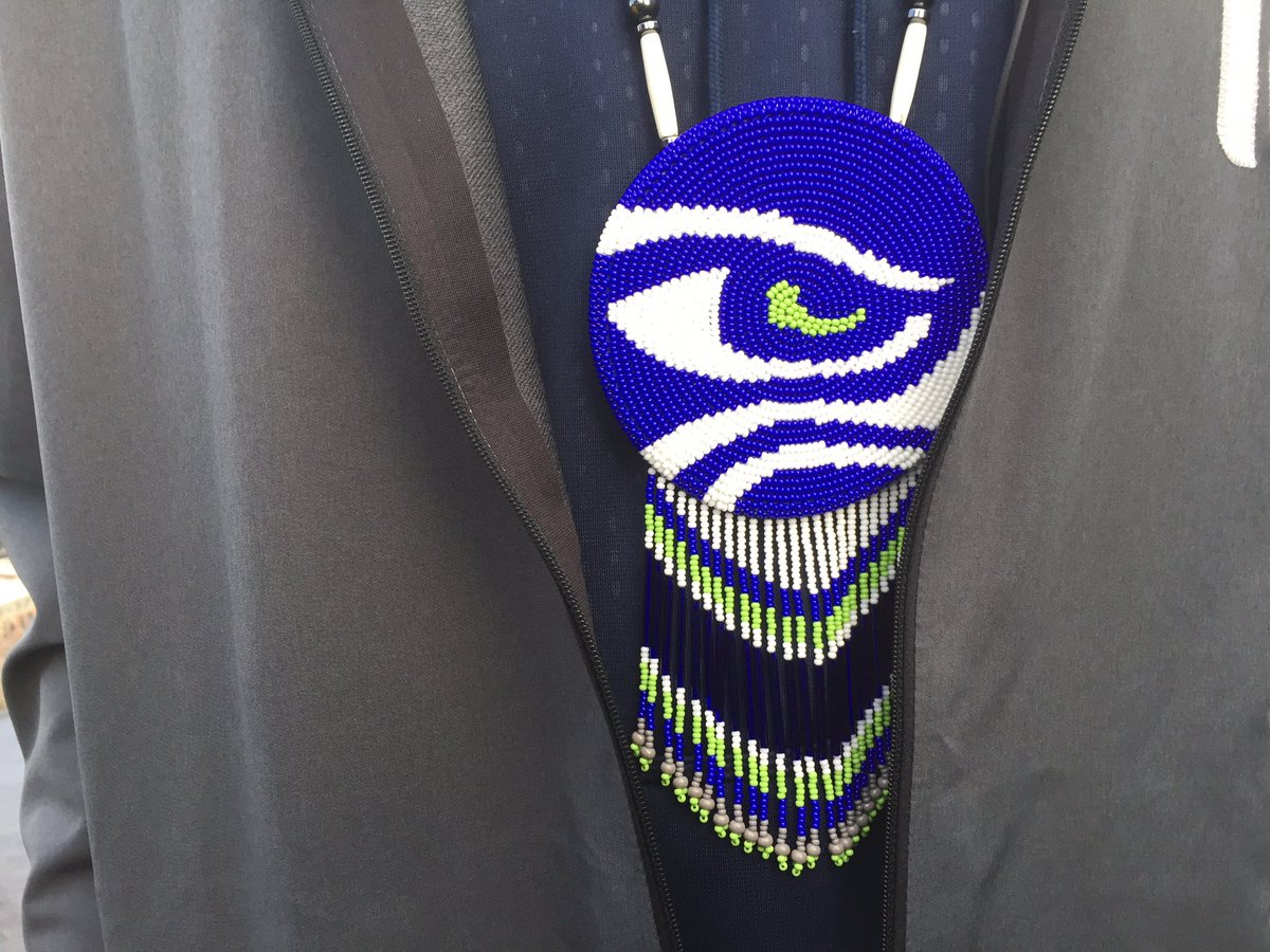 StephenRamaley's tweet image. Sydney Rice raised 12flag today @SpaceNeedle. Brought a special Pendant made by Native American Friend. Correction.#komonews