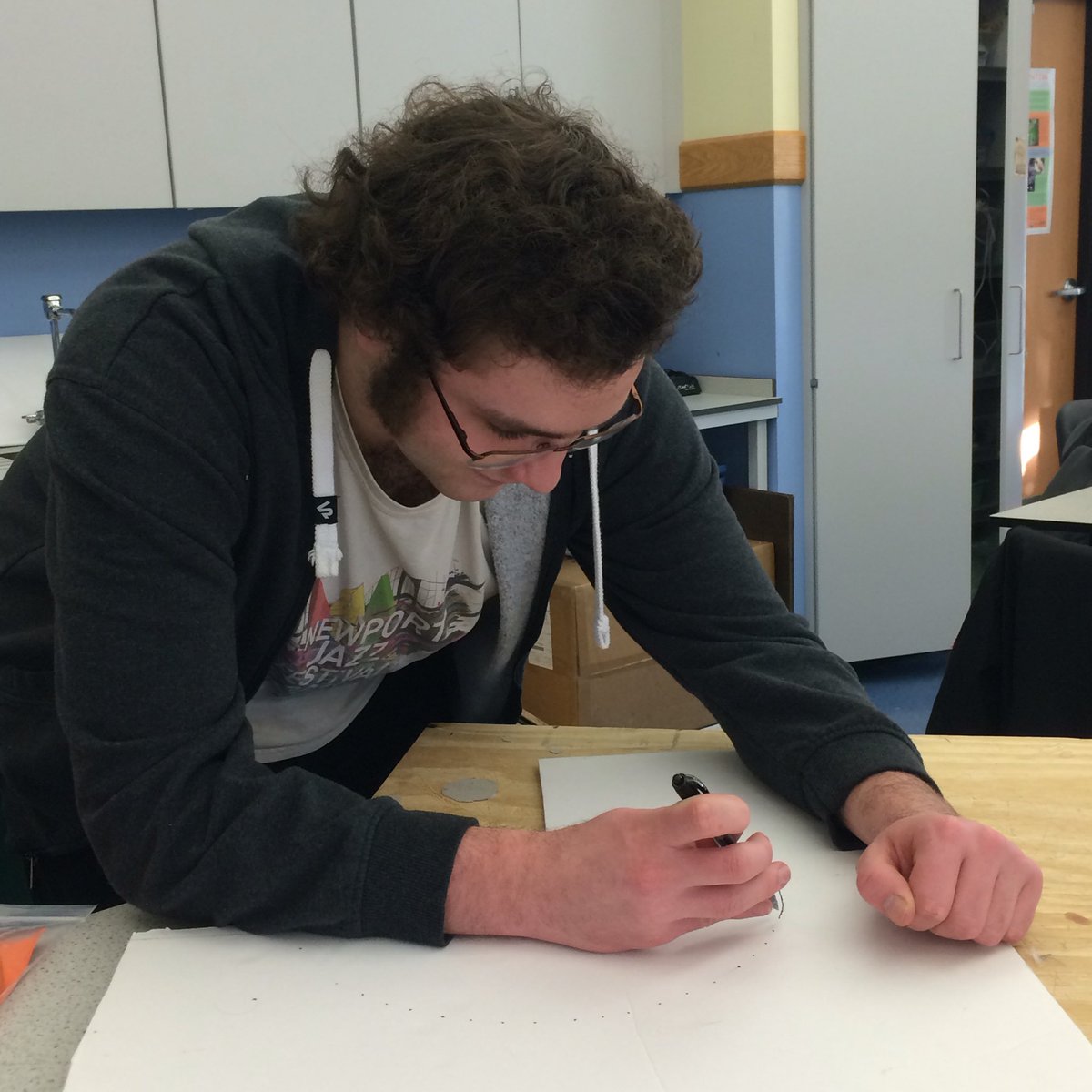 RamBotsLSA's tweet image. The mastermind behind the shooter prototype drafts a design. #FRC #firststeamworks #omgrobots