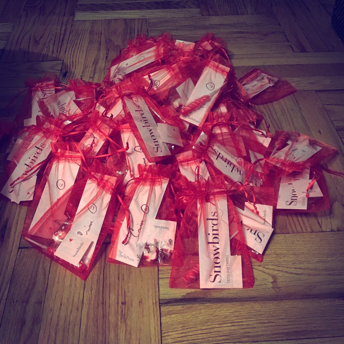 crissachappell's tweet photo. ...gathering up the gift bags for ALA Midwinter and the SNOWBIRDS launch party (Jan 28th, 7pm @BooksandBooks ) #MeritPress 🌟✨ https://t.co/xfFIYFlh8f