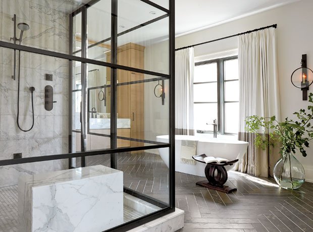 HouseandHome's tweet photo. With its handsome metal frame &amp; built-in marble bench, this shower makes a grand statement. https://t.co/KFv7qNL4PR https://t.co/gTAKN6yTic