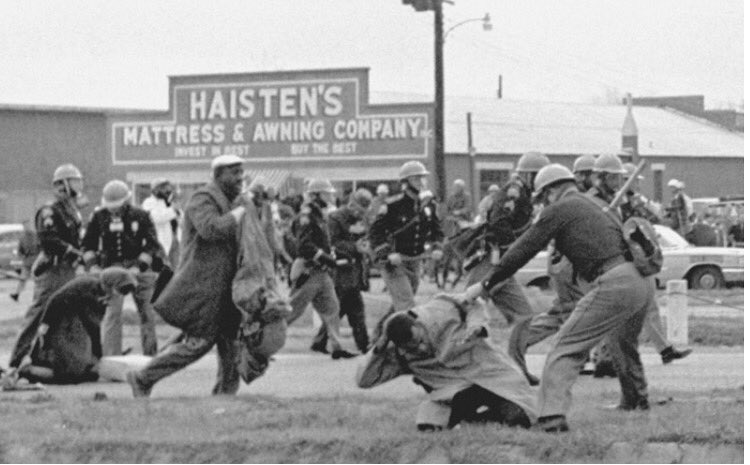 Donald Trump says John Lewis is all talk. 

Here's a picture of John Lewis being beaten by a state trooper on 'Bloody Sunday' in 1965.