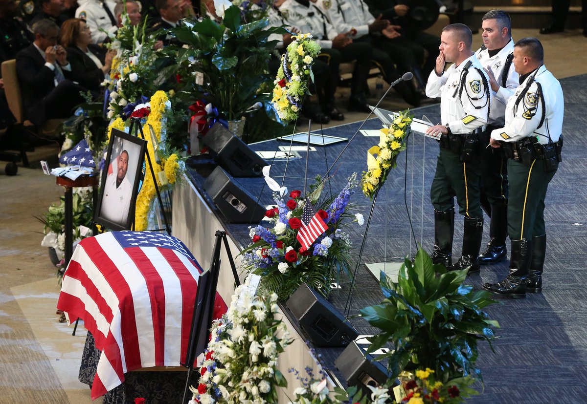 RedHuber's tweet photo. .@OrangeCoSheriff Lt. Carl Santiago blows a kiss to his fellow deputy OCSO Norman Lewis during funeral services at #firstbaptistorlando. https://t.co/bROIn5lbEf