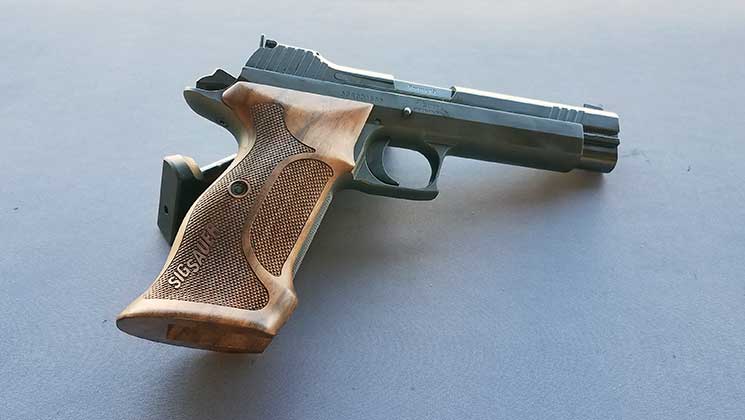 ShootingIllustr's tweet photo. Take a look at the new P210 American target #pistol from @sigsauerinc! Check out the video here: https://t.co/qhDOPFbGTJ #ShotShow https://t.co/sFLZi2kmZx