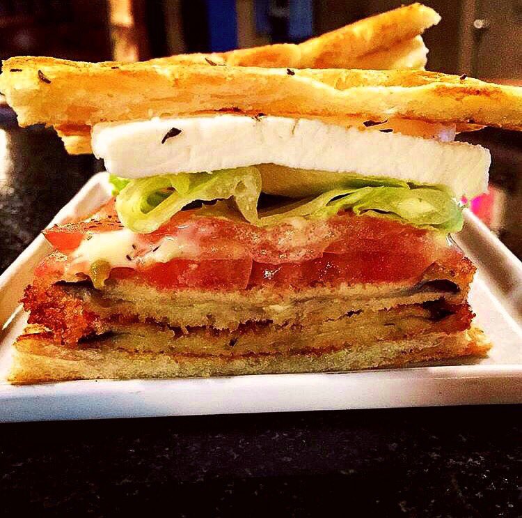 Revoltsandwich's tweet photo. 🇮🇹Travel to Italy today with our pan-seared #eggplantsandwich w/mozzarella, tomato, romaine &amp; caesar on a #pizzabianca from @GrandaisyBakery https://t.co/5lHR3sg1rB