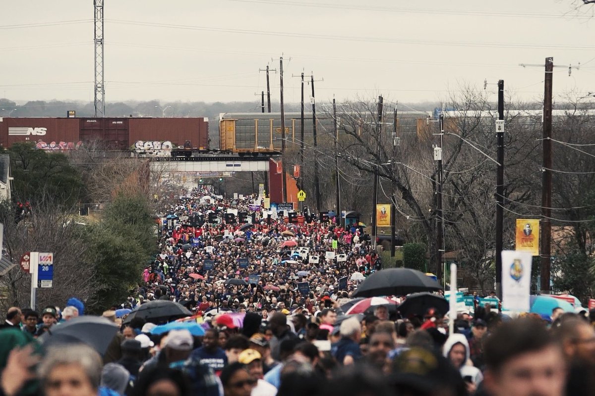 SAReport's tweet photo. Drizzle Fails to Dampen Turnout at MLK March https://t.co/V9BOIIW1Rb https://t.co/HF4Y4mQdyW