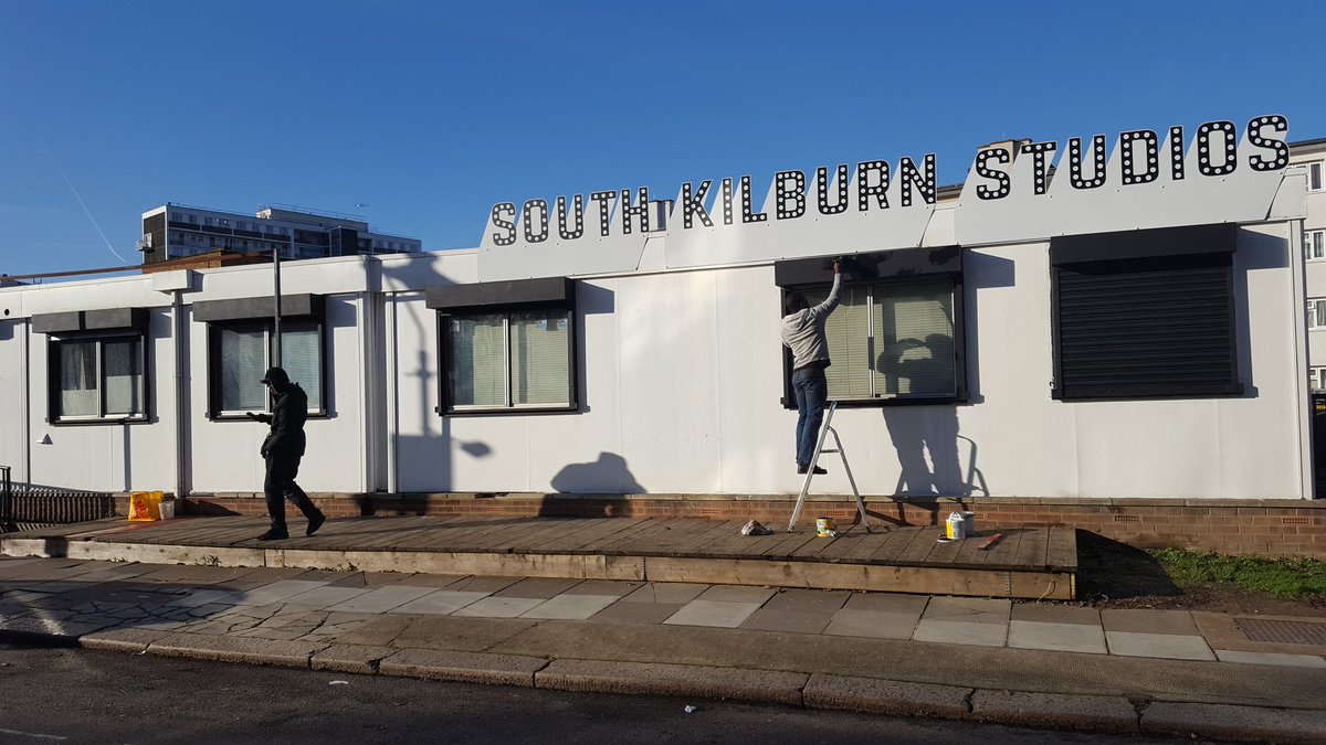 SKTrustNW6's tweet photo. #Blueskies in #SouthKilburn for day 2 of #SKMagic with @ArtIsMyHustle. What do you think of the new SK Studios sign!? https://t.co/7U21NhkaJZ