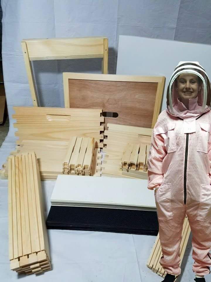 A deep/med hive kit of select grade pine and our own mini model in a pink standard SuperBee suit. (Fully ventilated with sting resistance)