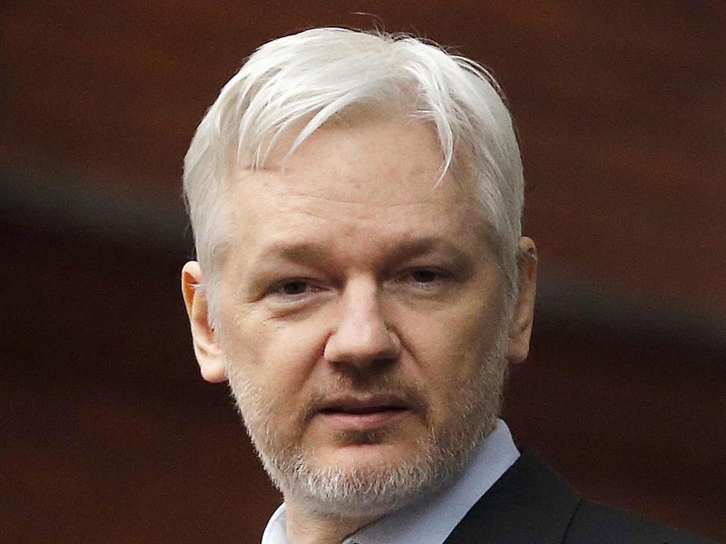 Julian Assange said he'll turn himself in if Obama pardons Manning