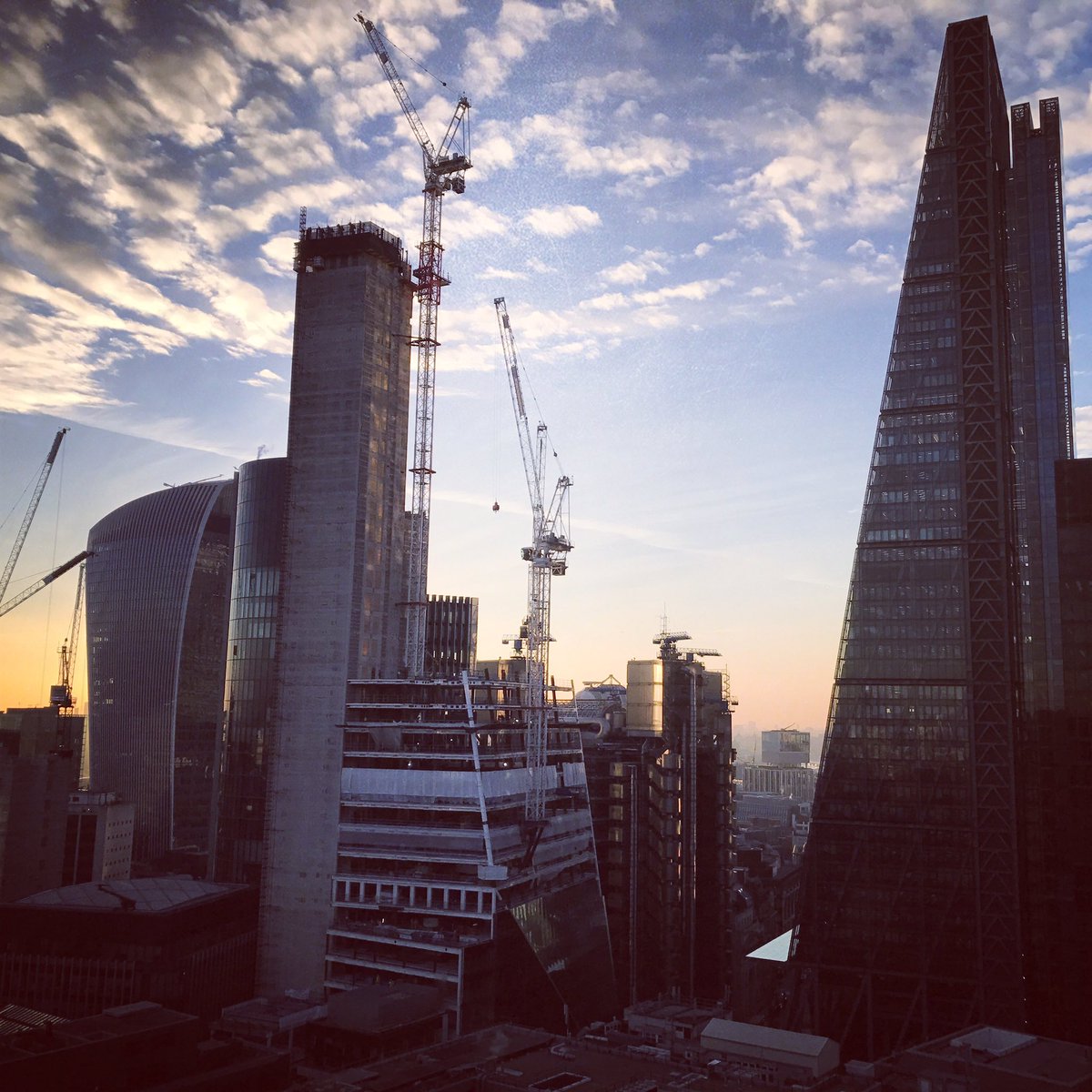 ProjectumUK's tweet photo. Sunset behind the Eastern Cluster in the @cityoflondon including the latest tower #LDN #skyscraper #cheesegrater #walkietalkie #thescalpel https://t.co/beejuyocTW