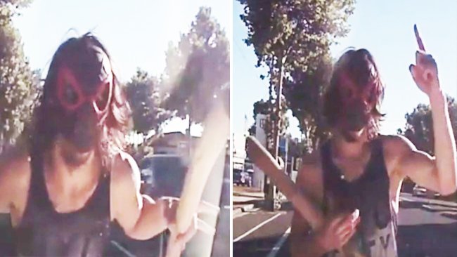 Masked man dances with a tree branch after almost being run over in bizarre Bendigo video: trib.al/GiY361P