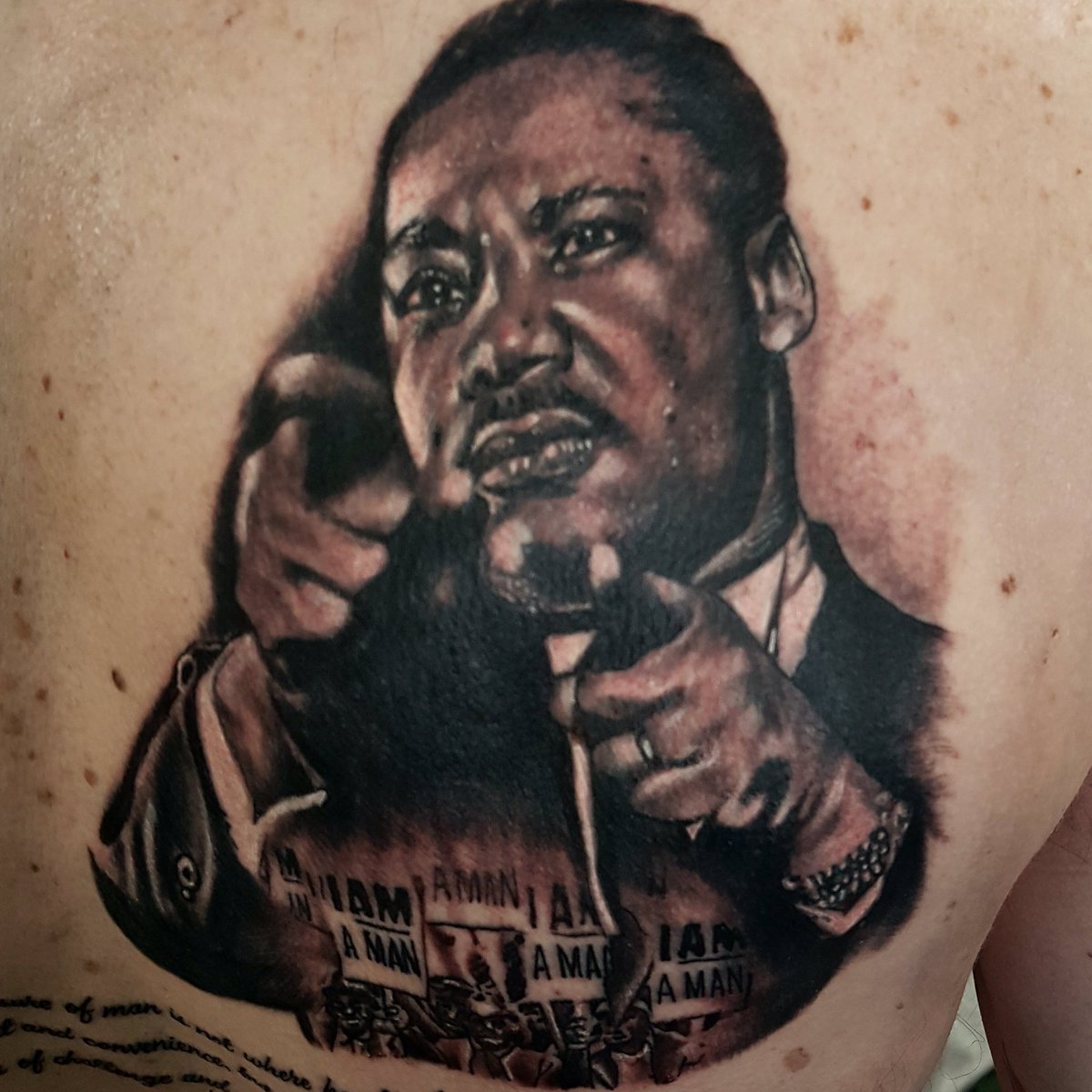 Photographing the black icons tattooed on Watford FC striker Andre Grays  back