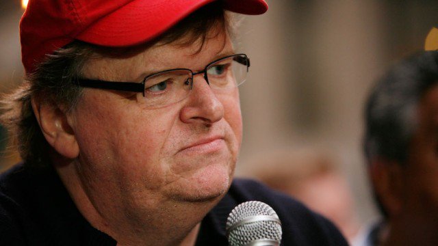 thehill's tweet photo. Michael Moore leads massive anti-Trump protest in NYC
https://t.co/mtdzOlfGoE https://t.co/Ga0mJeW2EF