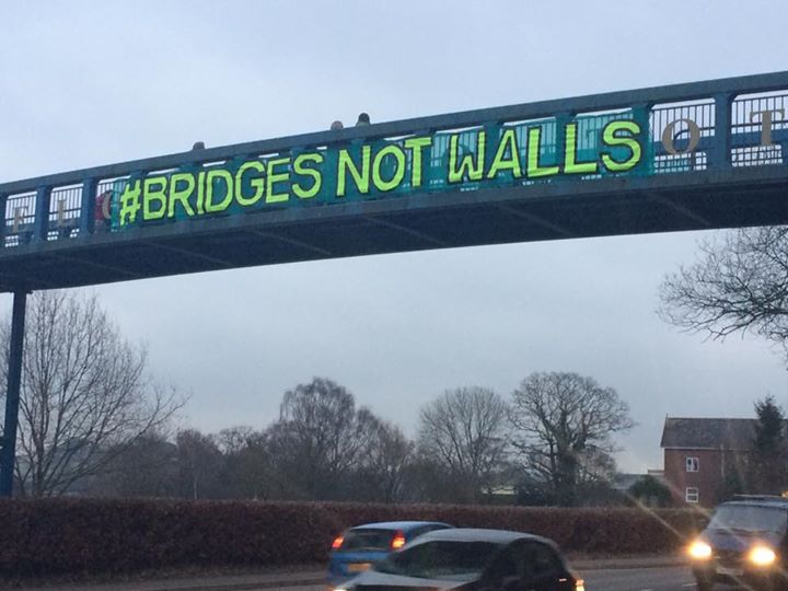 robintransition's tweet photo. Totnes this morning #bridgenotwalls. In solidarity with our brothers and sisters around the world. #Trump #Inauguration https://t.co/tvq1ji473h