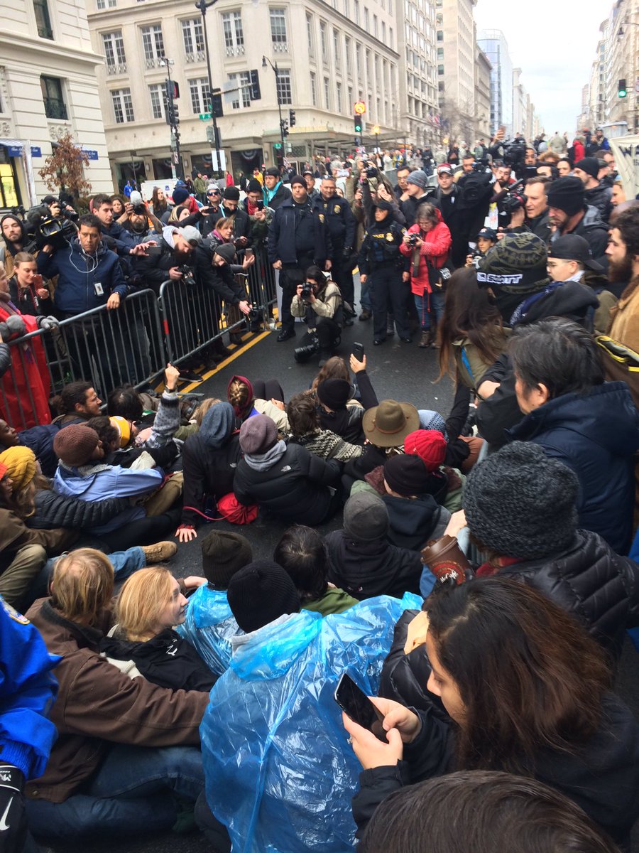 mattdpearce's tweet photo. Blocking one of the inauguration gates: "We stand with Standing Rock! We stand with Standing Rock!" https://t.co/Z7j0nihs2B