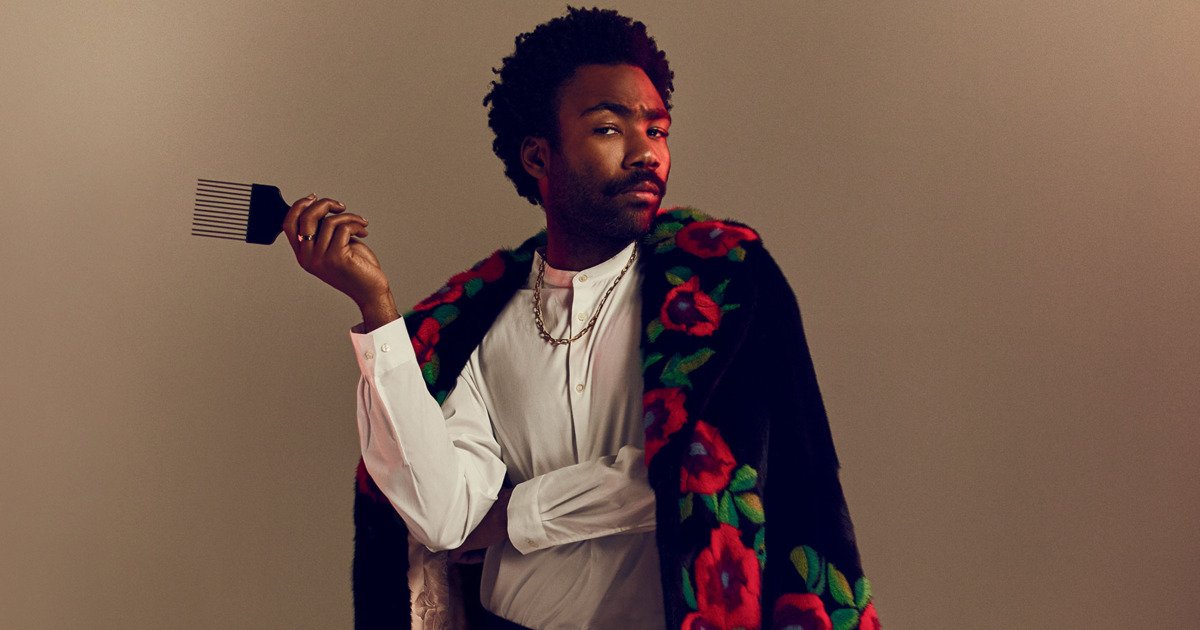 vulture's tweet photo. Coats were invented so that we could have this photo of Donald Glover https://t.co/9SytkEFbS5 https://t.co/ap2G9PovF7