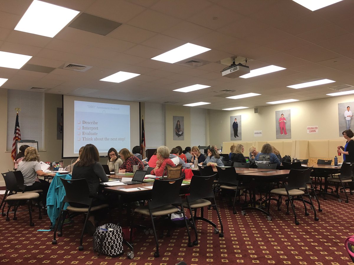 Third Grade teachers using the DIET protocol to analyze student work.