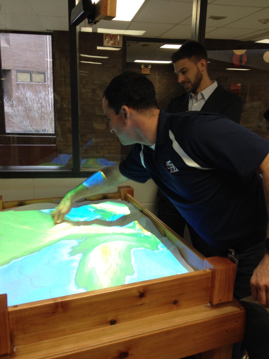 shswlib's tweet photo. So cool! Student Matt Tullo demonstrates new Augmented Reality Sand and Water Table at HSW Library. @SCSD_HSW https://t.co/sJyZe3LpyV