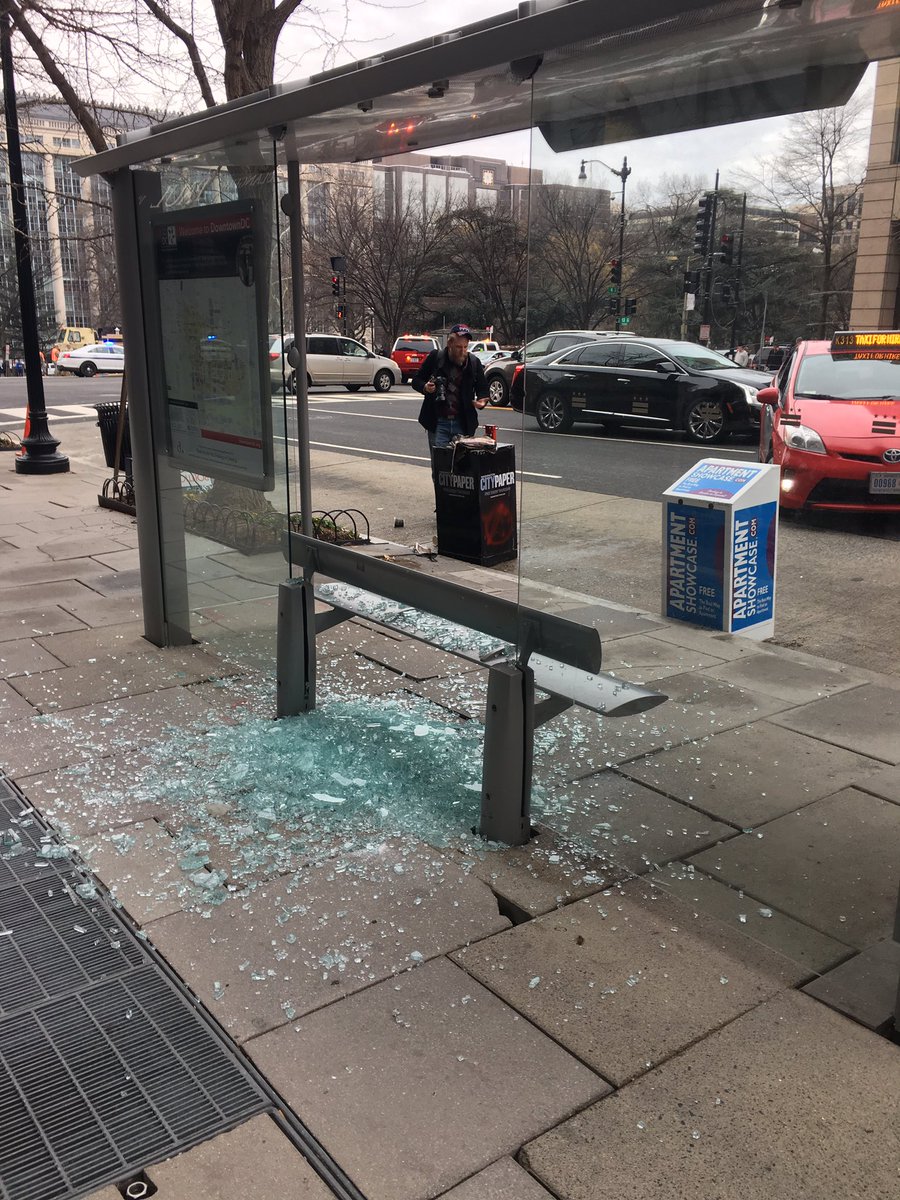 rquester's tweet photo. Protestors smashed bus stop at 13th and K #Inauguration https://t.co/1pagz1WyWi