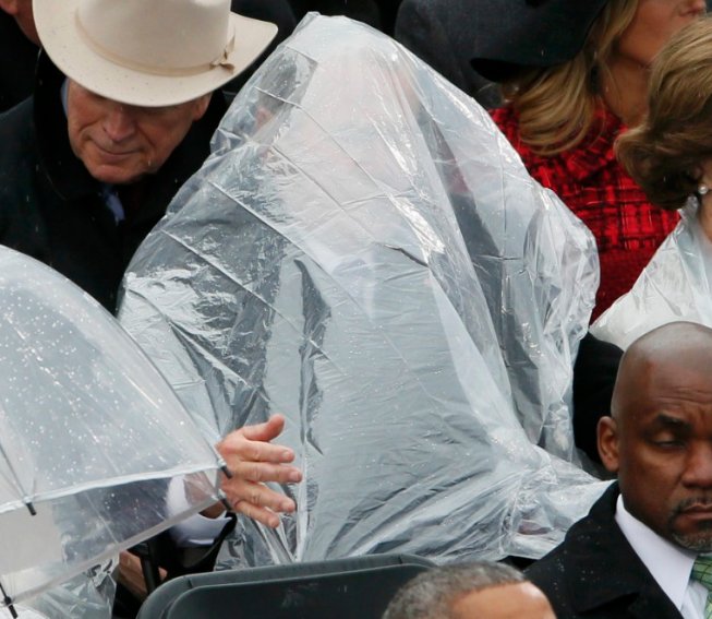 Telegraph's tweet image. The rain was no match for former President George W. Bush during the #inauguration