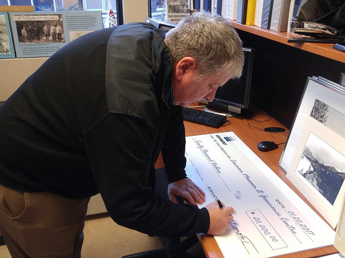 DanKatz_ott's tweet photo. Mario Couture from Graymont signing $20,000 cheque as donation for the #Canmore Museum https://t.co/z1QiW2nc4r