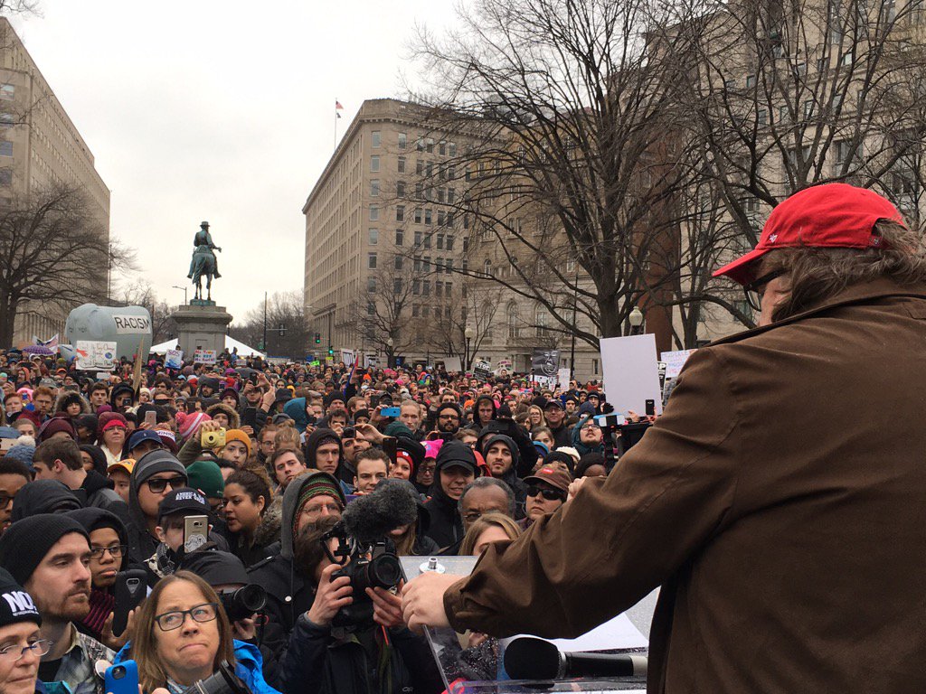 MMFlint's tweet image. Near the parade route, speaking to 20,000 protesters! Demonstrators outnumber pro-Trump crowd by a huge margin.
