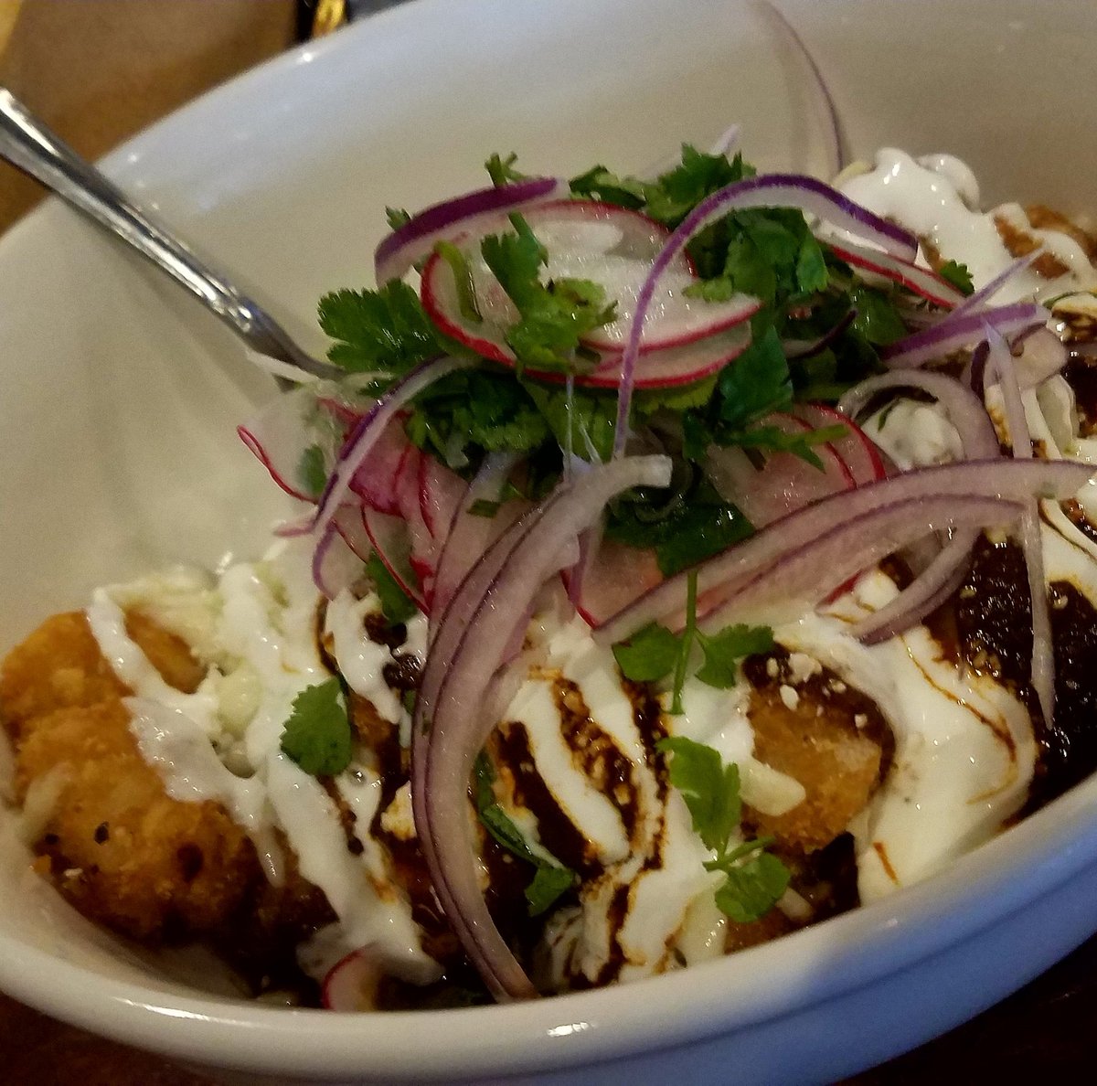 SasakiTime's tweet photo. Amazing mole tots from amor y tacos #foodporn #tatertots #moletots #happyhour #mexicanfood https://t.co/6ZcukjUdeb