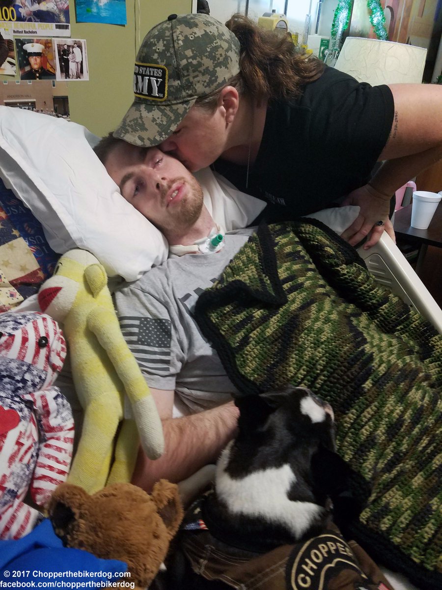 ChopperBikerDog's tweet photo. SPC Chase Simmons smiles as "a mom kisses her son", as I lay &amp; comfort this Soldier as I've been 4 the past 13 months #MomsLove #ChopperLove https://t.co/EdyOGs3GIh