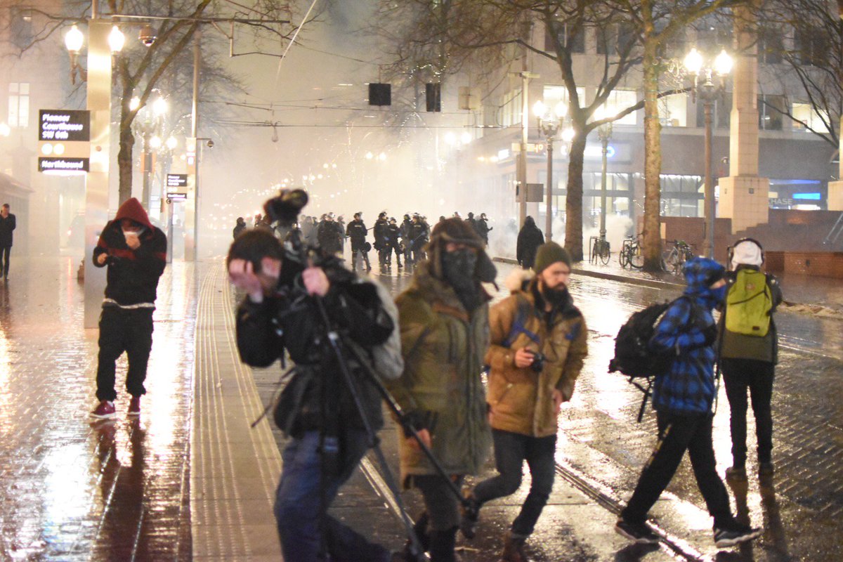 dougbrown8's tweet photo. Riot cops tear gas protesters (and me) https://t.co/ls8iJ8iUaf