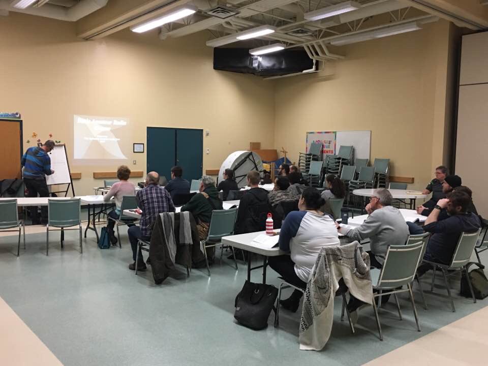VE5AA's tweet photo. Here's @ve5uo teaching capacitors and inductors forthe SARC basic amateur radio course. Almost 20 students! #hamr #hamradio https://t.co/GyXSe2DaLg