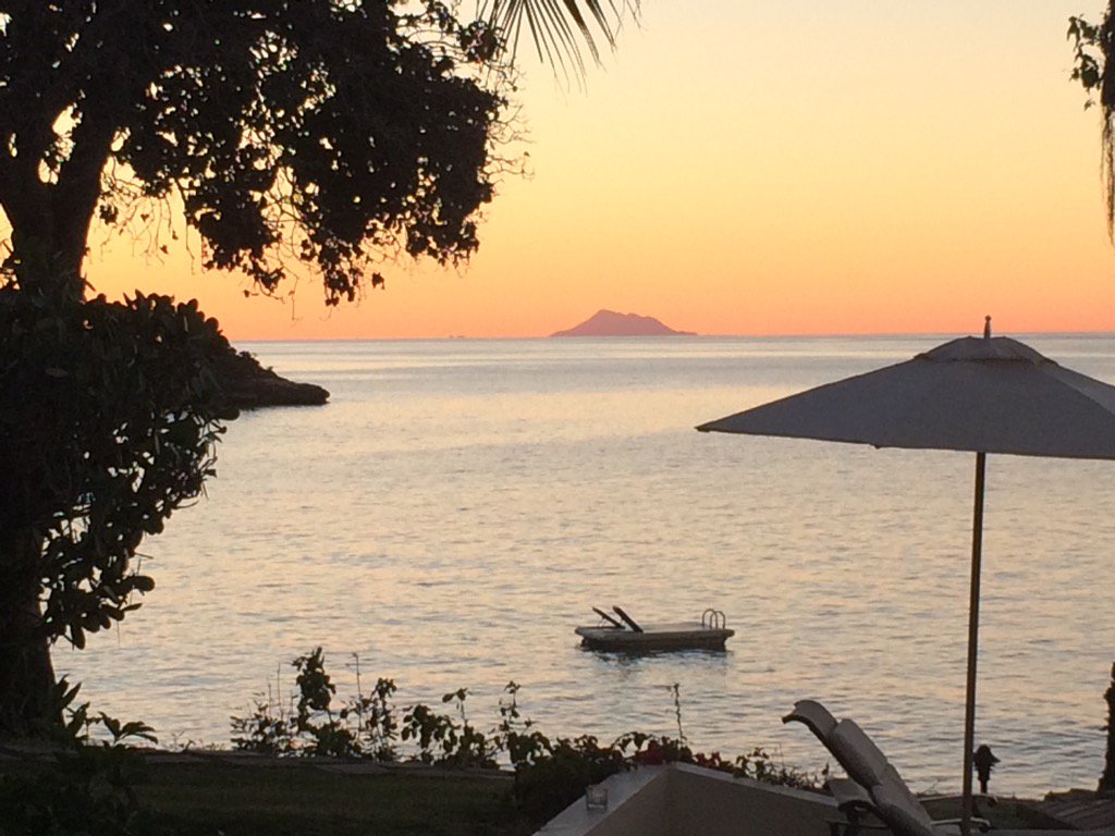 Montserrat at sunset - which means it's cocktail hour. #bluewatersresort #antigua #Caribbean