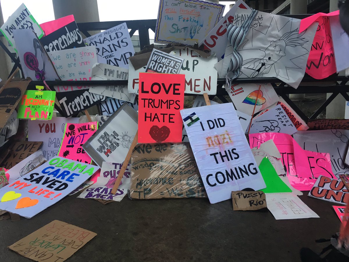 ameliaOPB's tweet image. Leftover signs at the east end of the Hawthorne bridge. #WomensMarchPortland #itrained