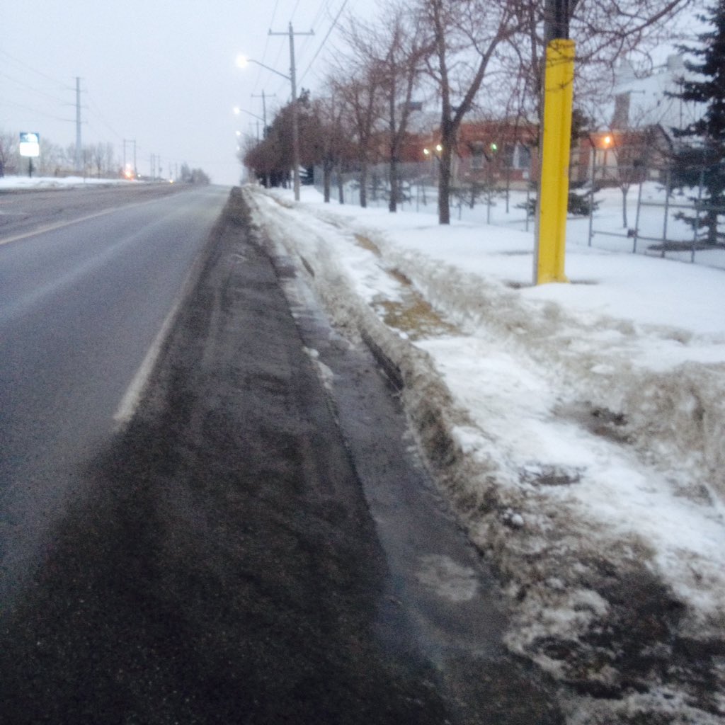WORK_in_BC's tweet photo. As promised @BluHrGirl @bikecalgary here is photo of 11 St SE bike path and snow cleared grassy pathway for peds. #yycbike #yyctraffic https://t.co/s8ngOsxo7B