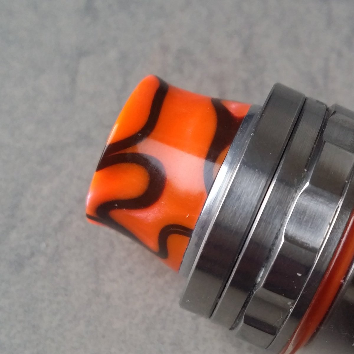 Handmade tfv8 driptip in orange with black swirl acrlyic.
The orange is a perfect match with the tfv8 o'rings 
#ukvapers #ukvape #vapinguk