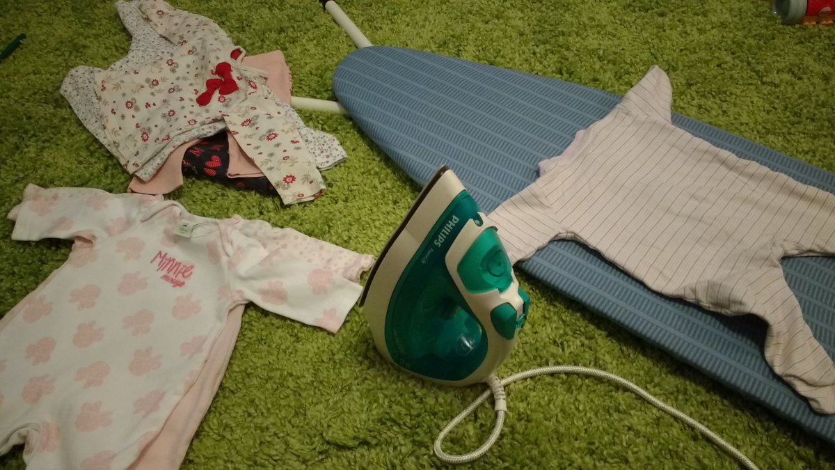 Just doing some ironing to make these tiny clothes look good as new!