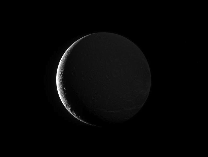 NASASolarSystem's tweet photo. ICYMI: The night side of Saturn's moon Dione, gently illuminated by Saturnshine. Details: https://t.co/q1axd9QY5z #SaturnSaturday https://t.co/HkAnyXXBme