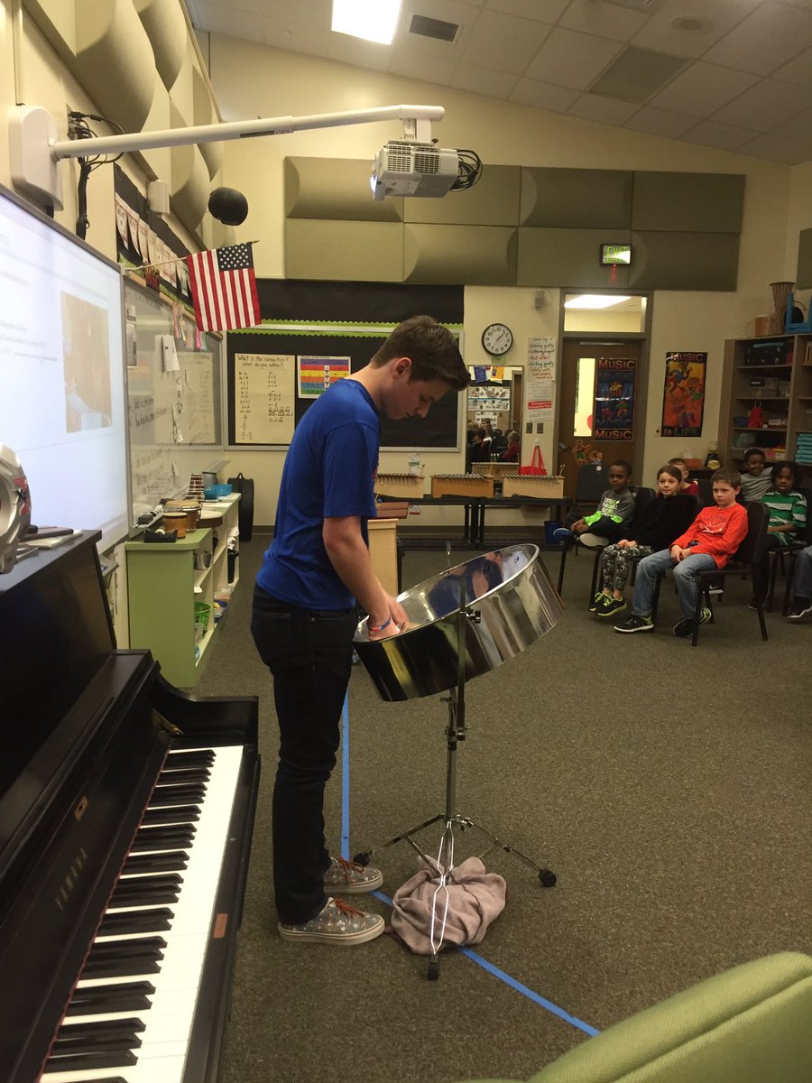 MusicSouthgate's tweet photo. Learning about steel drums from our HS music volunteer Ryan. We even tried playing it! #makingmusicrelevant #SouthgateTigers #sgeaction https://t.co/ncCVU5vTT6