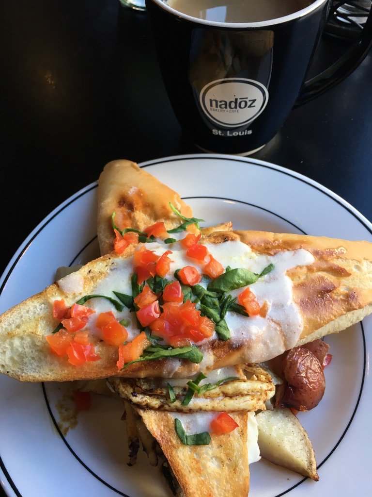 New at Nadoz! Shirred Eggs Baked in A French Baguette with Goat Cheese and Savory Derby Sauce atop Fried Potatoes #brunch #stleats
