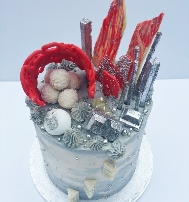 A 6 tier chocolate cake for an architect and his love of shapes and the color Grey.