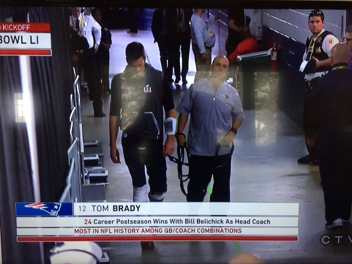 rjhusch's tweet image. Handler keeping Tom away from the game balls before the game.  #LeashGate