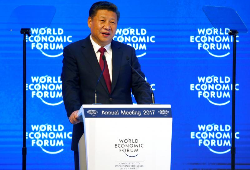 Reuters's tweet photo. As Trump stresses 'America First', China plays the world leader https://t.co/pzkLy7lKm4 https://t.co/ZYF5FBSa6i
