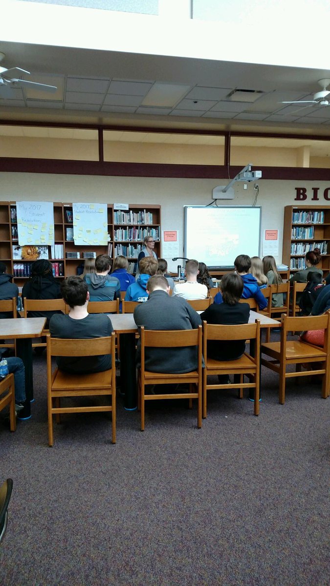 WoodridgeReads's tweet photo. Mrs. Israeli giving a presentation to 8th graders about her grandfather's experience during the Holocaust. #WMSLibrary https://t.co/OQ0Cn2Mj1e