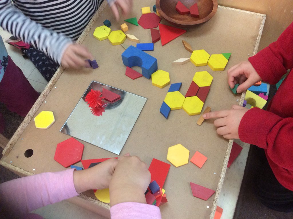 Students bringing shapes to the pet store.  P made animals