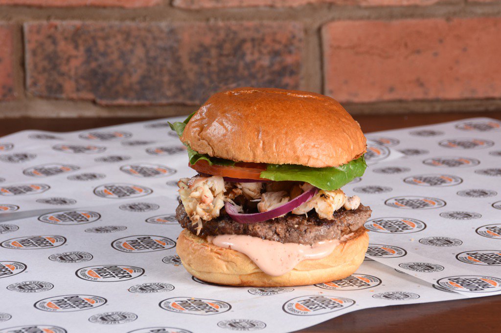 The Real Surf and Turf Burger. A 6oz Aberdeen Angus burger topped with seafood sauce and real lobster tail! Devine!