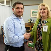 VolCenterSWLA's tweet image. Incoming Volunteer Center Board President Lisa Guerrero presents outgoing Board President Oliver Clark with a token of appreciation.