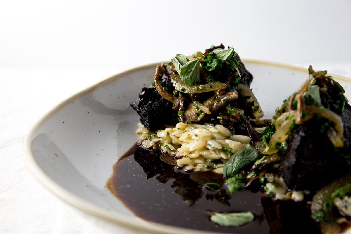 Beef Cheek Bourguingnon, creamy garlic &amp; parmesan orzo, smoked mushroom salad, black garlic soubise.