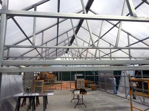 SantoHighSchool's tweet photo. Greenhouse roofing panels are on and side walls going up today. Woo-hoo! https://t.co/IyYSnohvRp