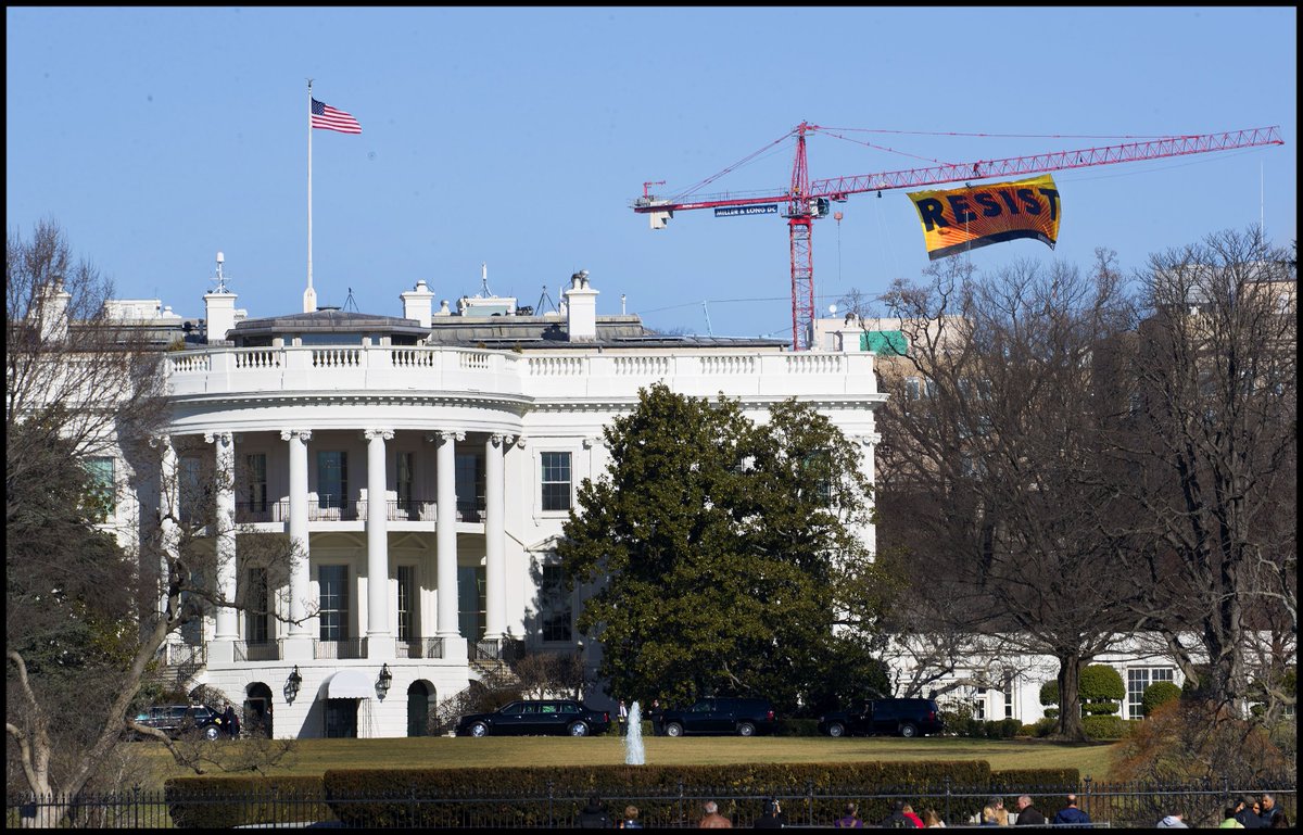 dougmillsnyt's tweet photo. The Greenpeace protest banner reading "RESIST" is seen just blocks from the White House. @Greenpeace https://t.co/WDKWC8qLsl