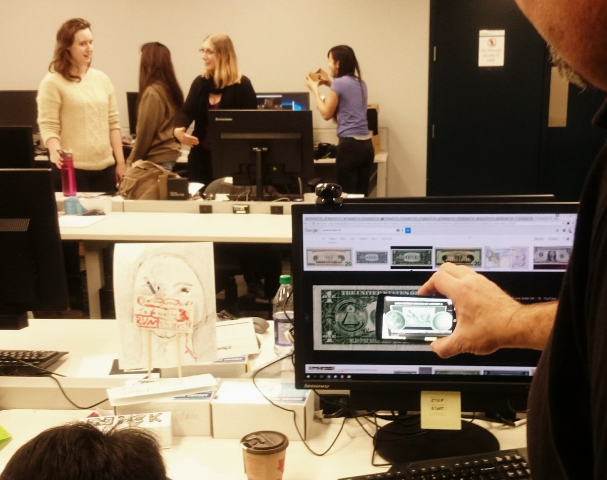 ballsofnick's tweet photo. Looking at embedded secrets on the dollar bill @SheridanIMM #AR #aurasma while girls play #oculus #GoogleCardboard https://t.co/qxuHJO91A7